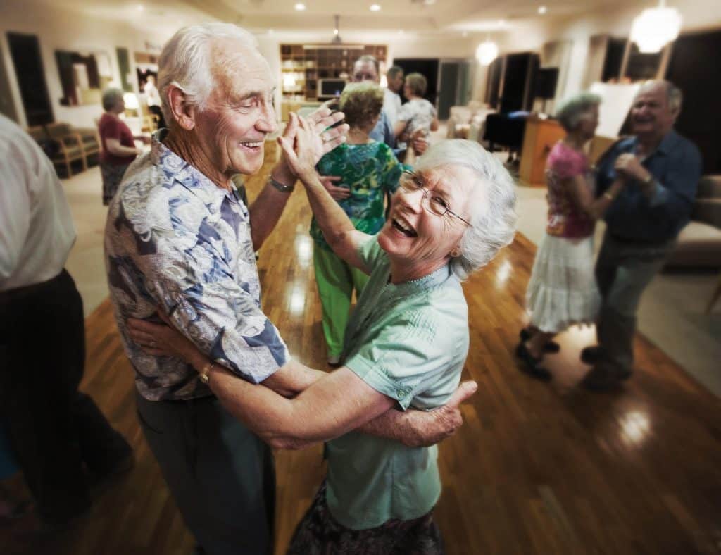 two senior people dancing