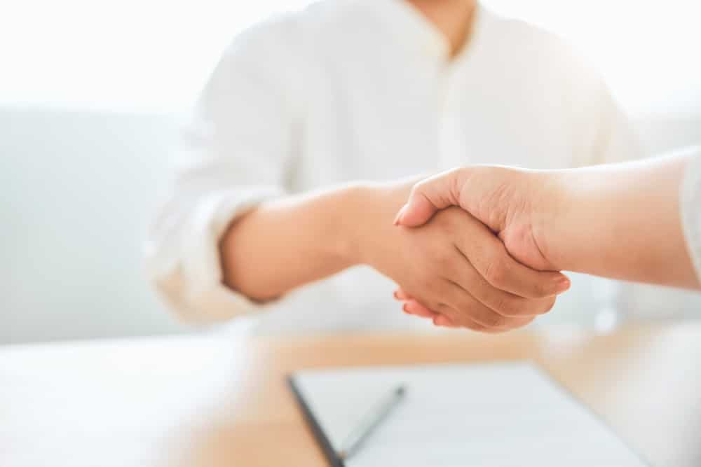Close up of partnership handshake successful after negotiating business. Connection deal concept. Close up of partnership handshake successful after negotiating business. Connection deal concept.