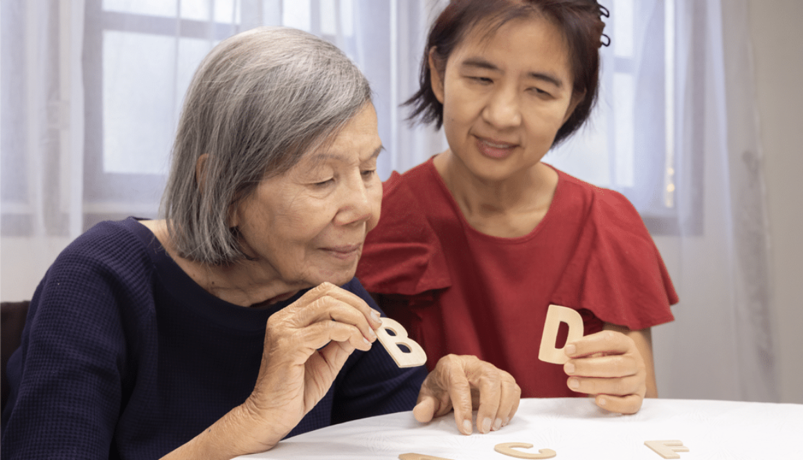 elderly-woman-playing-alphabet-games-improve-mental-health-memory-with-daughter