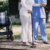 young-asian-physical-therapist-working-with-senior-woman-walking-with-walker